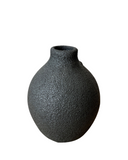 Three porcelain crater vases in beige, white, and black colors, each with a textured, frothy glaze.