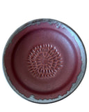 Ceramic plate with a decorative design on a white background