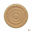 A round piece of beige clay with a textured surface, marked with a number 6.