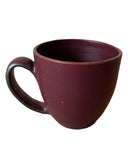Brown ceramic mug on a white background