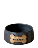 A set of three custom dog bowls in sizes, each with a bone-shaped name plate, in matte black color.