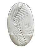 Decorative plate with leaf design on a white background