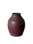 A Luna Striped Vase in the foreground. The vases are crafted from brown stoneware clay with striped patterns in various shades of bronze.