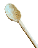 Ceramic spoon on a white background