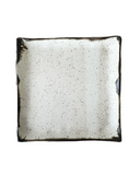 A square ceramic dinner plate with a beige center and bronze lip.