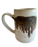 A ceramic mug on a white background