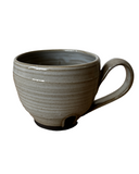 Gray and black mug on white background
