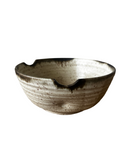 Beige noodle bowl on white background
