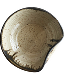 Speckled ceramic bowl on a white background