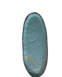 long oval teal ceramic serving tray with stamped design