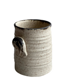 Beige utensil holder on white background