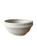 Beige bowl on a white background 