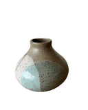 A green palo santo burner on a white background. 