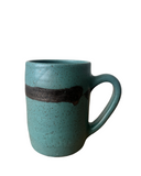 Teal ceramic mug with a dark brown stripe on a white background