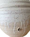 Close-up of a textured ceramic bowl with speckled pattern