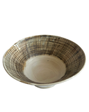 Ceramic bowl with textured design on a white background