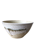 Ceramic bowl with textured surface on a white background