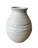 Speckled gray ceramic vase on a white background