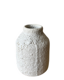 A set of three white porcelain vases with a textured, frothy glaze, in varying shapes and sizes, displayed against a white background.