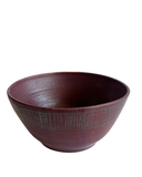dark red ceramic bowl on a white background