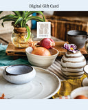 Collection of ceramic items including bowls and vases on a table with a 'CS Ceramics' logo.