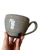Gray and black mug on white background