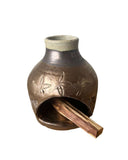gold beige palo santo burner on white background 