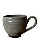 Gray and black mug on white background