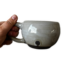 Gray and black mug on white background