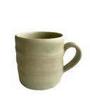 avocado green ceramic mug on a white background