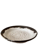 Ceramic plate with decorative pattern on a white background