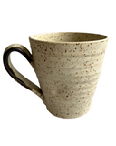 Beige mug on white background