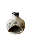 Ceramic palo santo burner chiminea with floral patterns on a white background