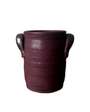 Burgundy crock on white background