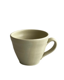 greenish yellow ceramic mug on a white background