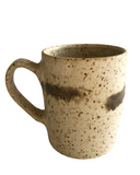 A beige mug on a white background