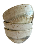 A set of ceramic bowls on a white background