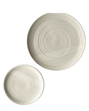 A dinner and side plate on a white background