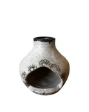 Ceramic palo santo incense burner with black floral patterns on a white background
