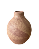 Textured ceramic vase on a white background