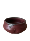 Stack of handcrafted ceramic pinch bowls in black, white, and brown colors