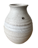 Speckled gray ceramic vase on a white background