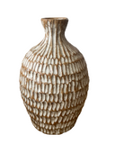 Decorative vase with a textured pattern on a white background