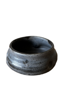 Stack of handcrafted ceramic pinch bowls in black, white, and brown colors