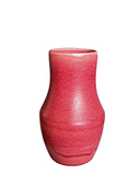 Pink textured vase on a white background