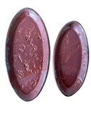 Two oval-shaped ceramic trays with a speckled beige and white glaze finish. One is small and the other is medium-sized.