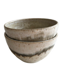 A set of ceramic bowls on a white background