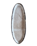 Oval beige tray on a white background. 