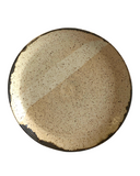 Beige ceramic plate on white background