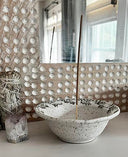 Decorative bowl with textured surface in a room setting
